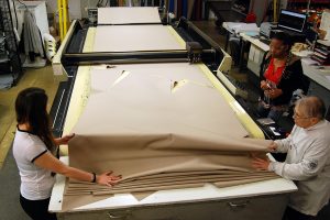 T-top boat cover fabric being cut on a CNC machine